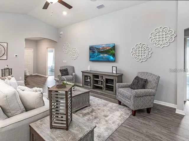 a living room with furniture and a large window