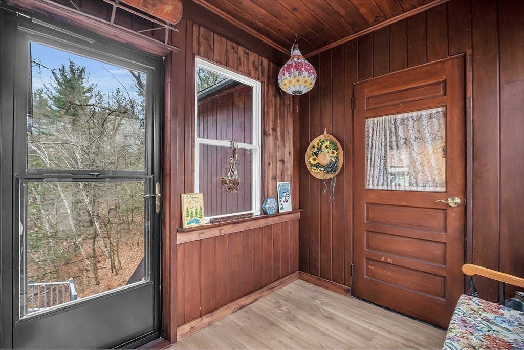 16 Ridgewood Road Groton, MA 01450 - Photo 5 of 36 a view of a hallway with wooden floor and a window