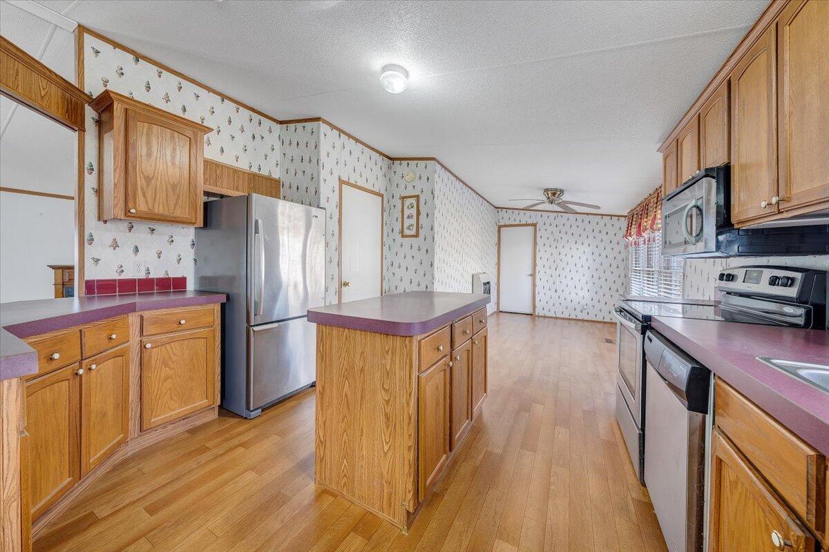 829 Moorman Mill Road Rustburg, VA 24588 - Photo 12 of 45 a kitchen with stainless steel appliances a refrigerator and a stove top oven
