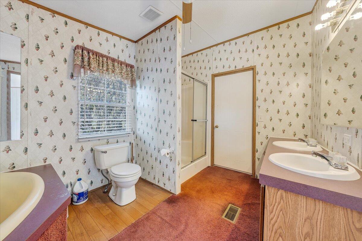 829 Moorman Mill Road Rustburg, VA 24588 - Photo 24 of 45 a bathroom with a granite countertop sink toilet and shower
