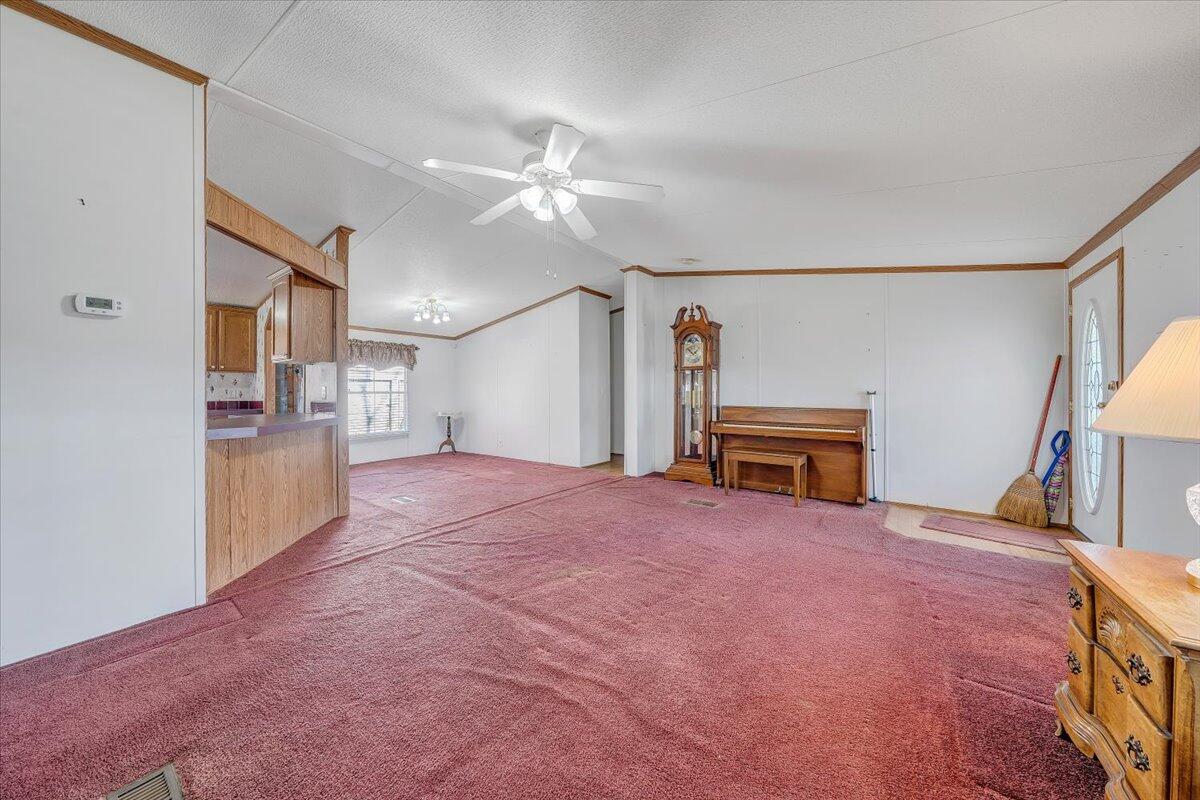 829 Moorman Mill Road Rustburg, VA 24588 - Photo 7 of 45 a view of an empty room with window and a kitchen