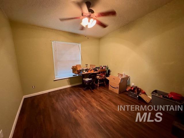 7880 Sweet Ola Highway Sweet, ID 83670 - Photo 13 of 24 Office with dark wood-style flooring, a textured ceiling, and ceiling fan