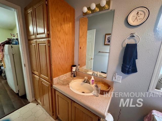 7880 Sweet Ola Highway Sweet, ID 83670 - Photo 18 of 24 Bathroom featuring vanity and a textured wall