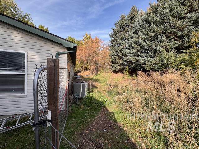 7880 Sweet Ola Highway Sweet, ID 83670 - Photo 23 of 24 View of property exterior featuring a central air condition unit