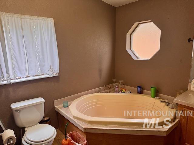 7880 Sweet Ola Highway Sweet, ID 83670 - Photo 10 of 24 Full bathroom with a garden tub and vanity