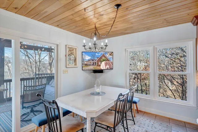 a view of living room with furniture and a floor to ceiling window