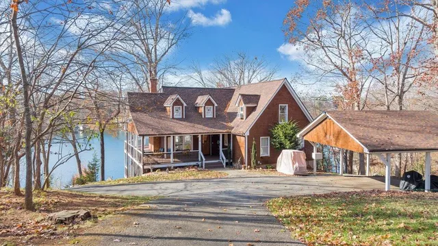 a view of a lake with couches and city view
