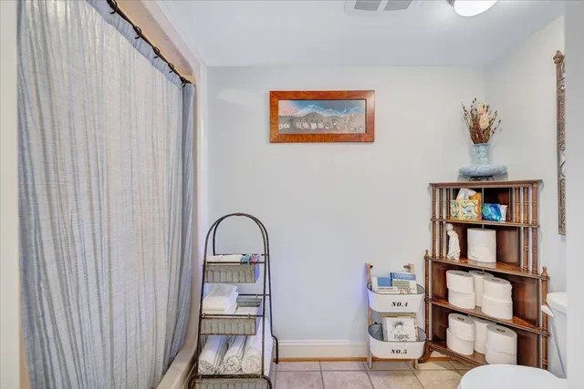 a bathroom with a granite countertop sink toilet and a mirror