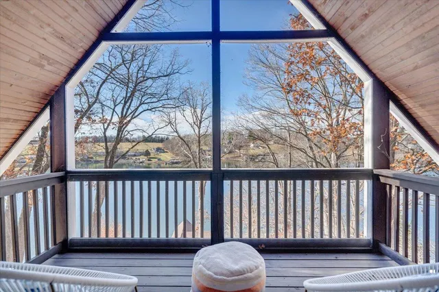 a view of a lake with houses in the back