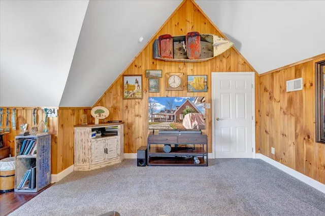 a kitchen with stainless steel appliances granite countertop a refrigerator and a stove