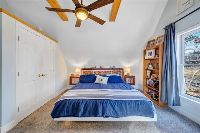 an aerial view of residential houses with outdoor space and river