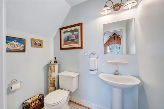 a room with a bed and a large window