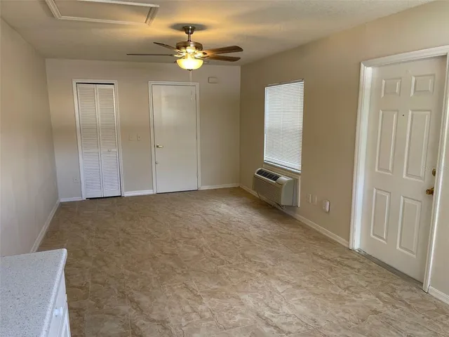 a view of a house with swimming pool and sitting area