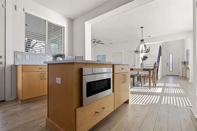 a kitchen with stainless steel appliances granite countertop a stove and cabinets