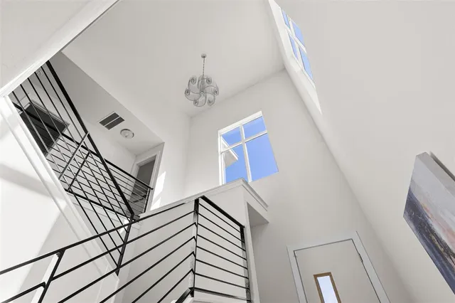 a view of an entryway with wooden floor