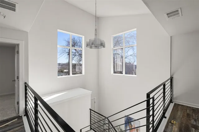a view of an entryway with wooden floor
