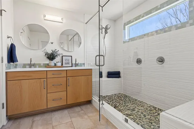 a bathroom with a sink a vanity and a mirror