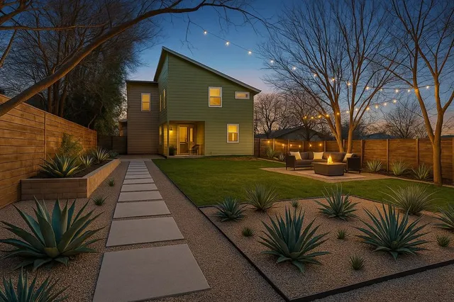 a backyard of a house with table and sofas