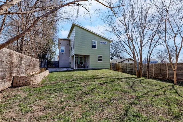 a house is covered with snow in front of house