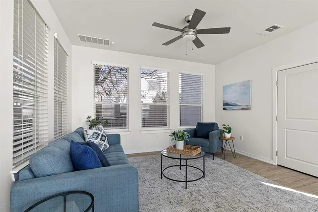 a living room with furniture and a large window