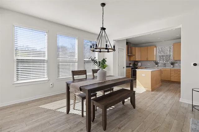 a view of a kitchen and dining room
