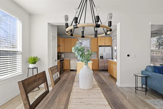 a view of living room filled with furniture and wooden floor