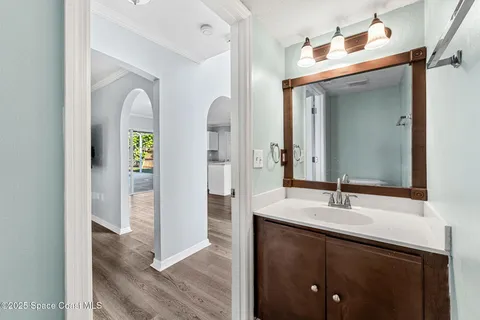 a en suite bathroom with a sink and mirror