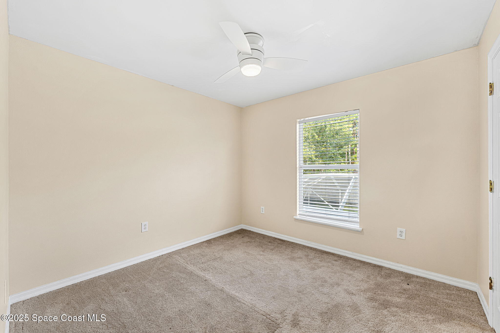 1249 White Oak Circle Melbourne, FL 32934 - Photo 18 of 34 an empty room with windows
