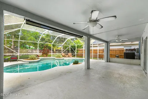 a view of a house with a big yard and large window