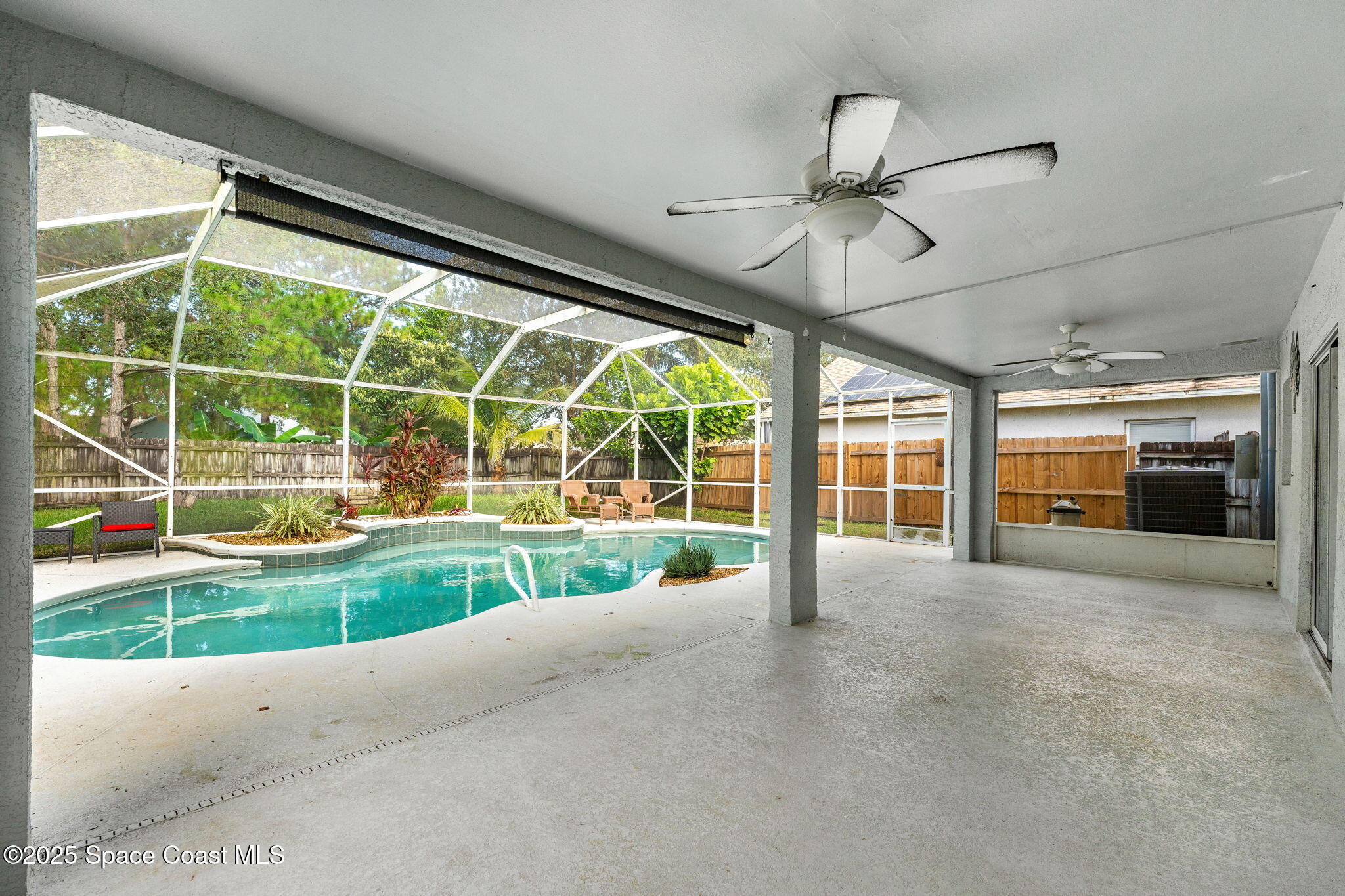 1249 White Oak Circle Melbourne, FL 32934 - Photo 22 of 34 a view of a house with a big yard and large window