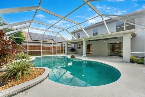 a view of a swimming pool with a patio