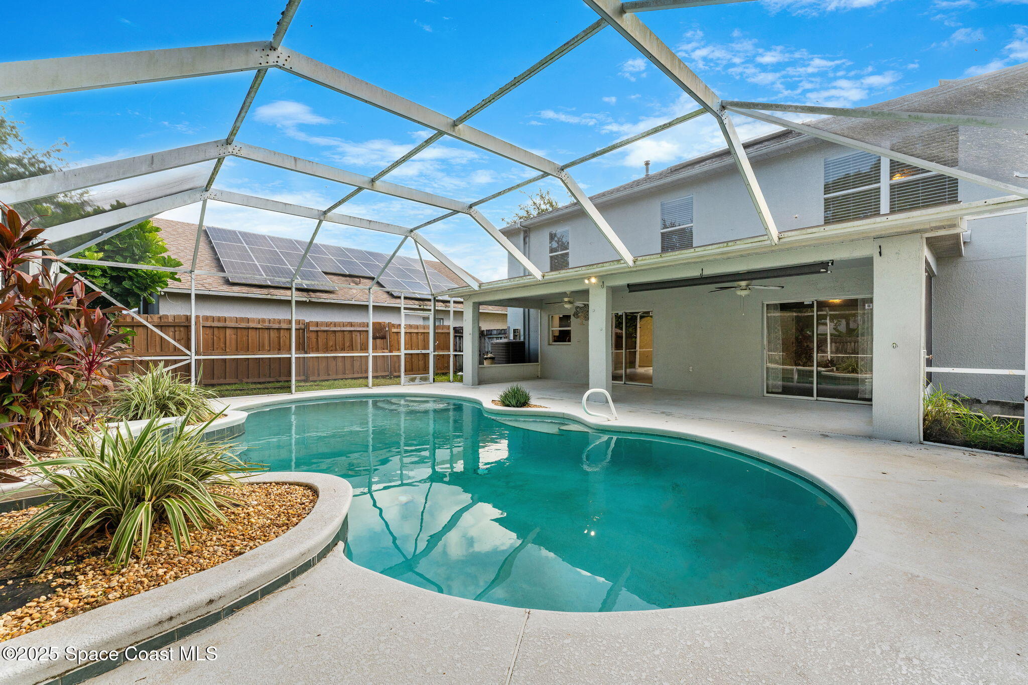 1249 White Oak Circle Melbourne, FL 32934 - Photo 23 of 34 a view of a swimming pool with a patio
