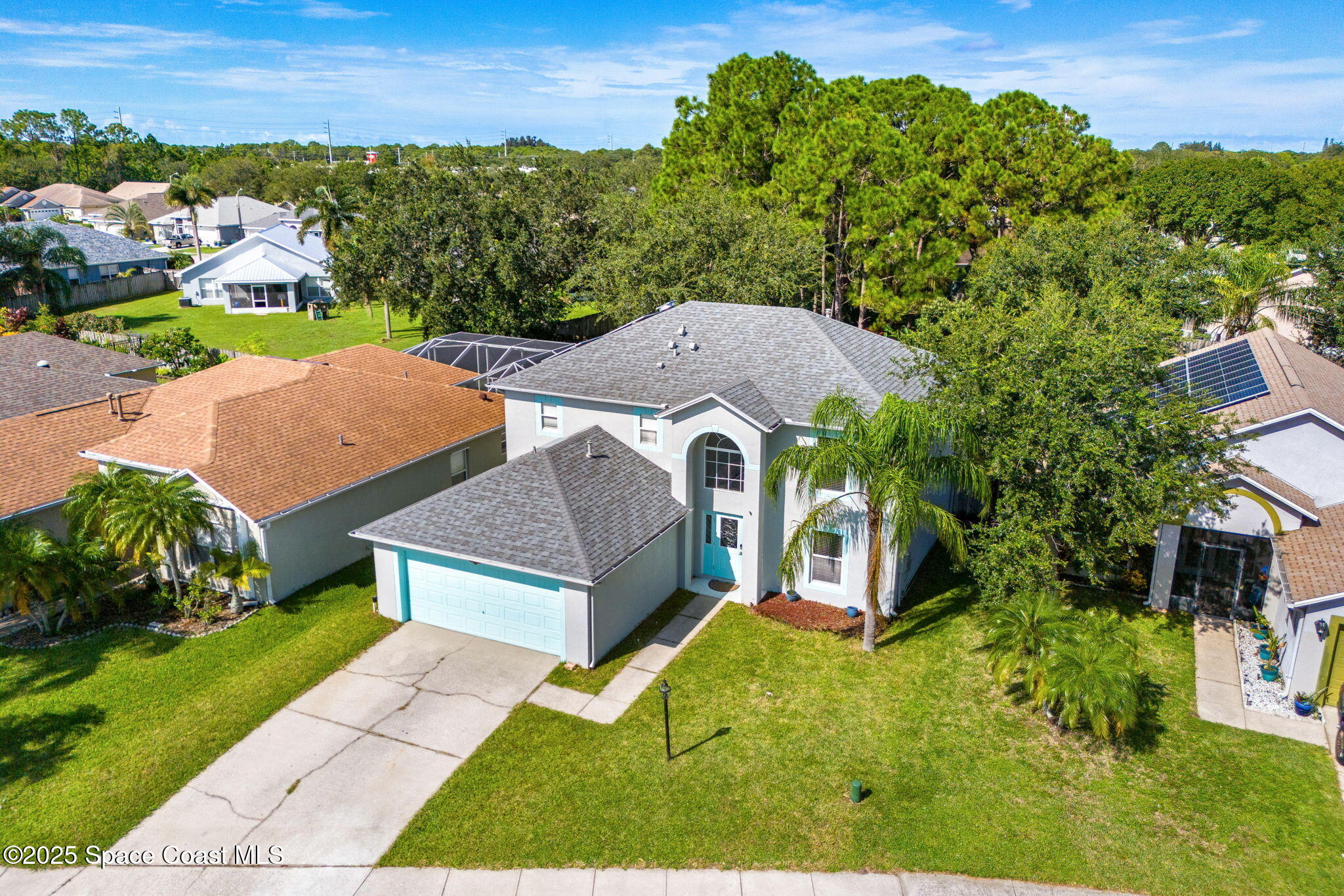 1249 White Oak Circle Melbourne, FL 32934 - Photo 26 of 34 an aerial view of a house with a garden