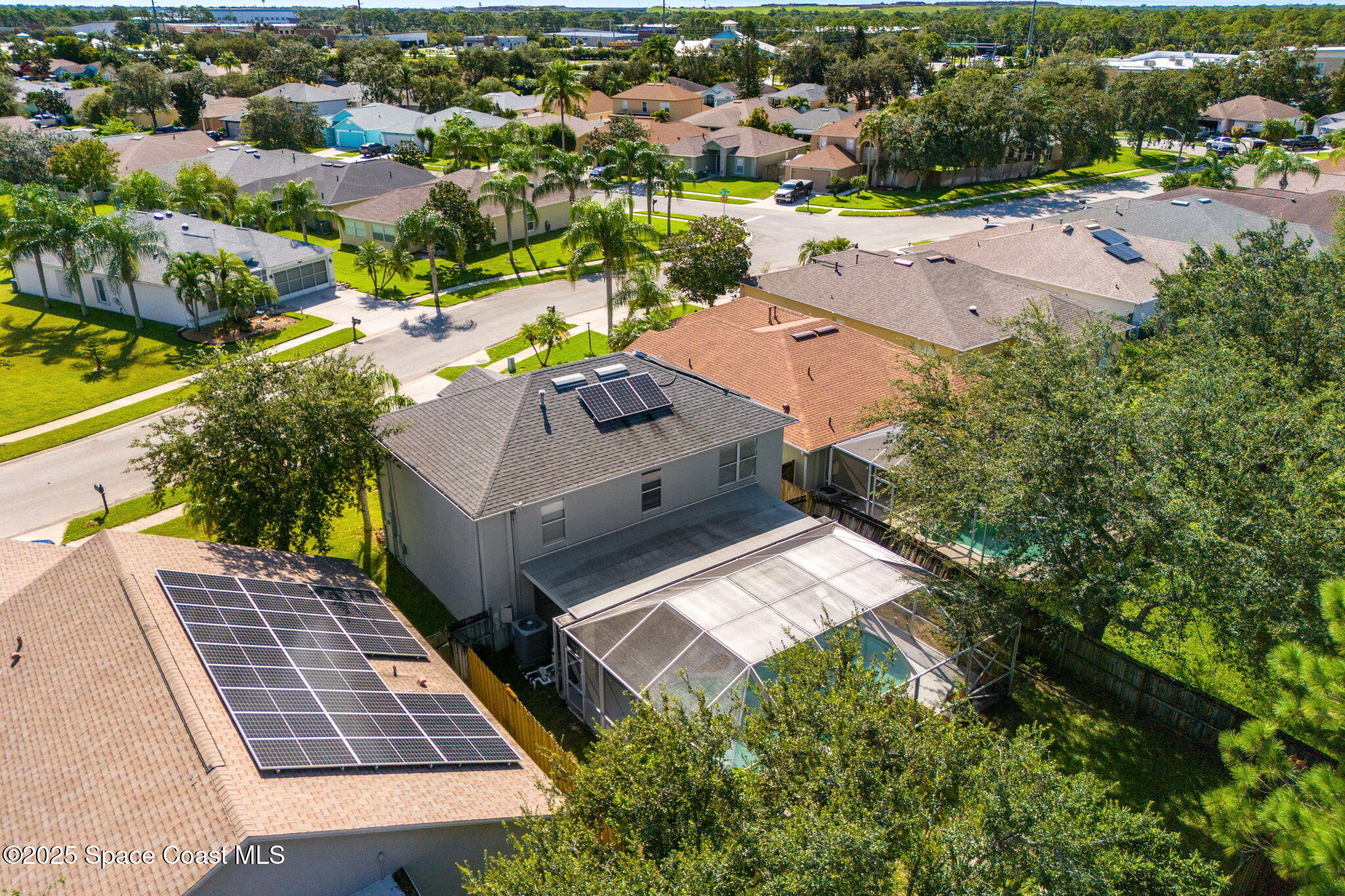1249 White Oak Circle Melbourne, FL 32934 - Photo 27 of 34 an aerial view of a house with a yard and outdoor seating