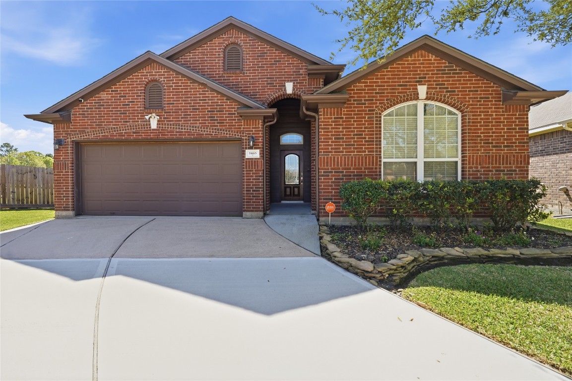 5803 Deleon Trail Drive Spring, TX 77379 - Photo 1 of 33 a front view of a house with garden