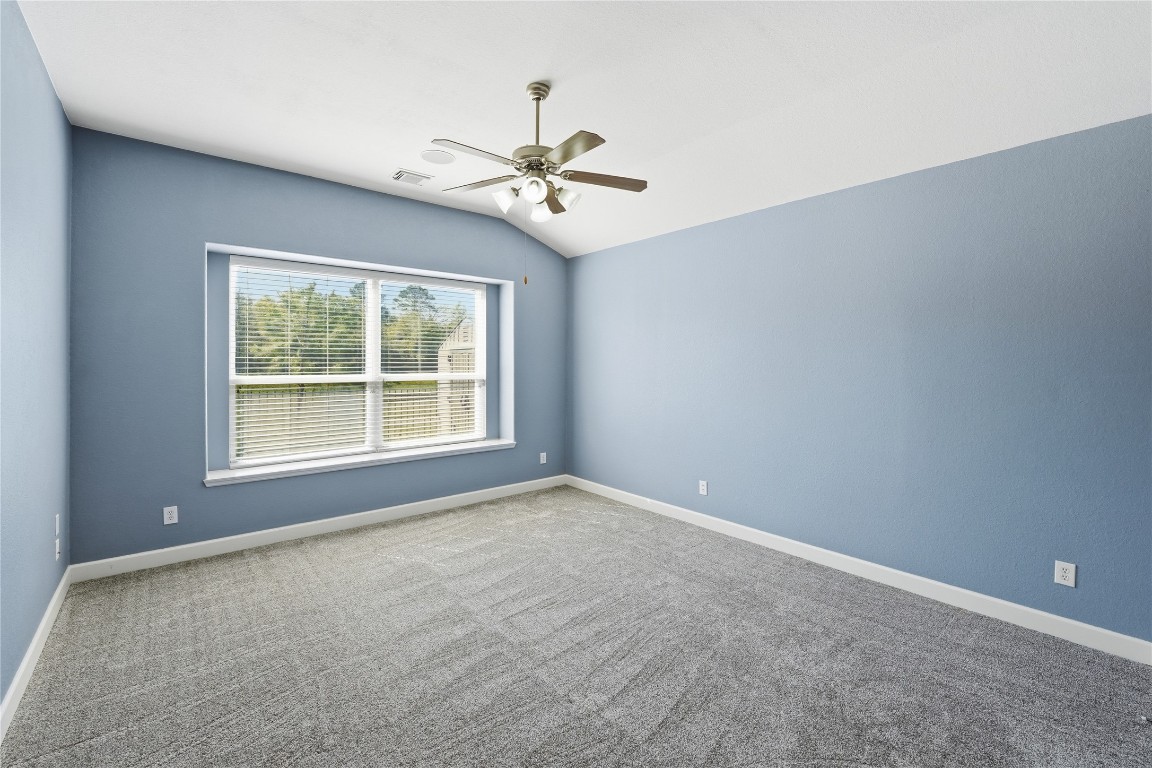 5803 Deleon Trail Drive Spring, TX 77379 - Photo 13 of 33 an empty room with windows and fan