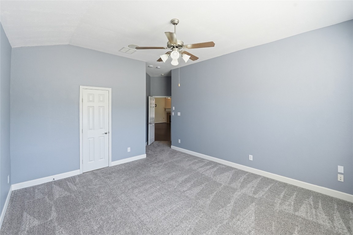 5803 Deleon Trail Drive Spring, TX 77379 - Photo 15 of 33 a view of an empty room with a ceiling fan