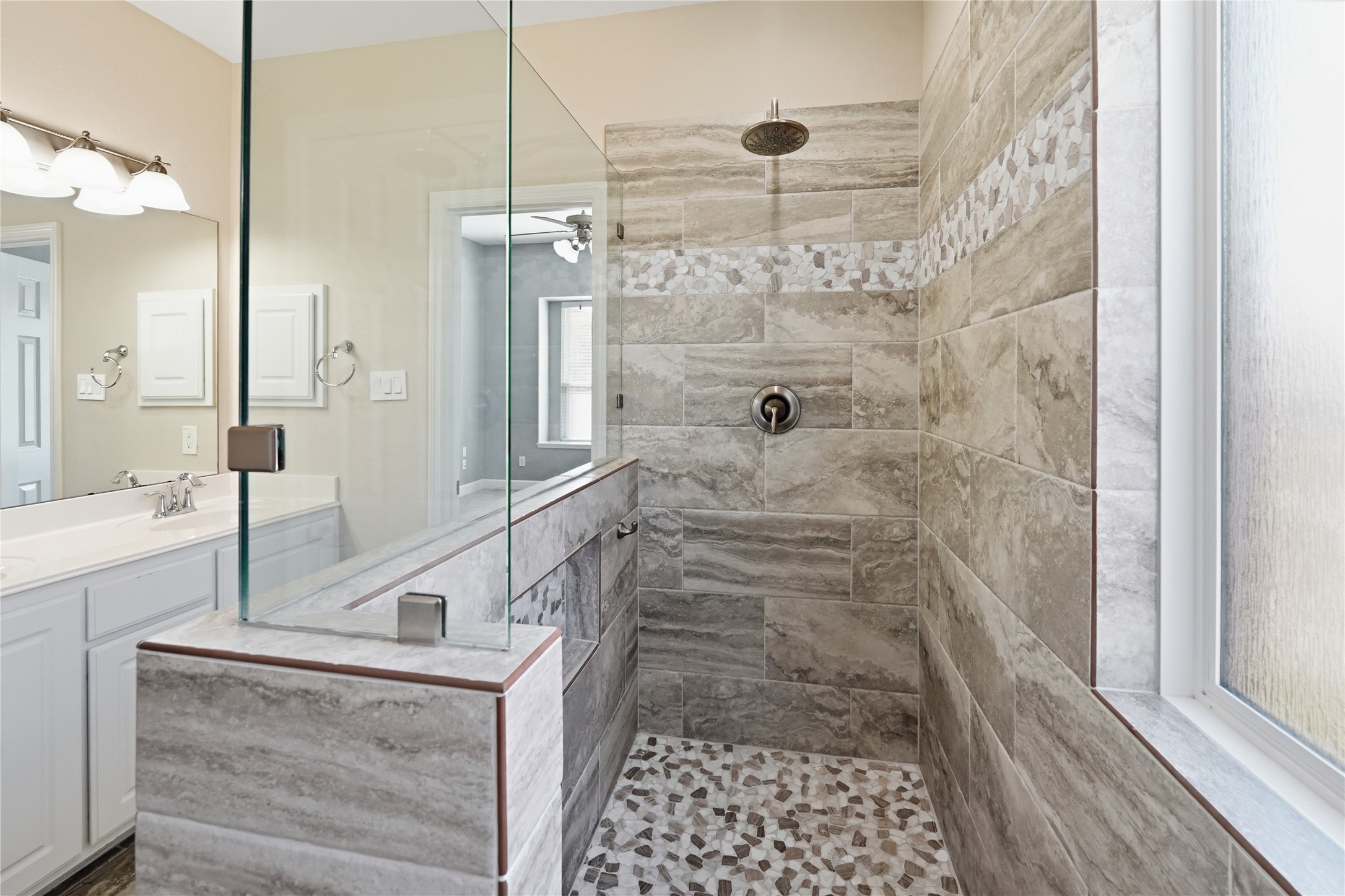 5803 Deleon Trail Drive Spring, TX 77379 - Photo 19 of 33 a bathroom with a granite countertop shower a sink and a mirror