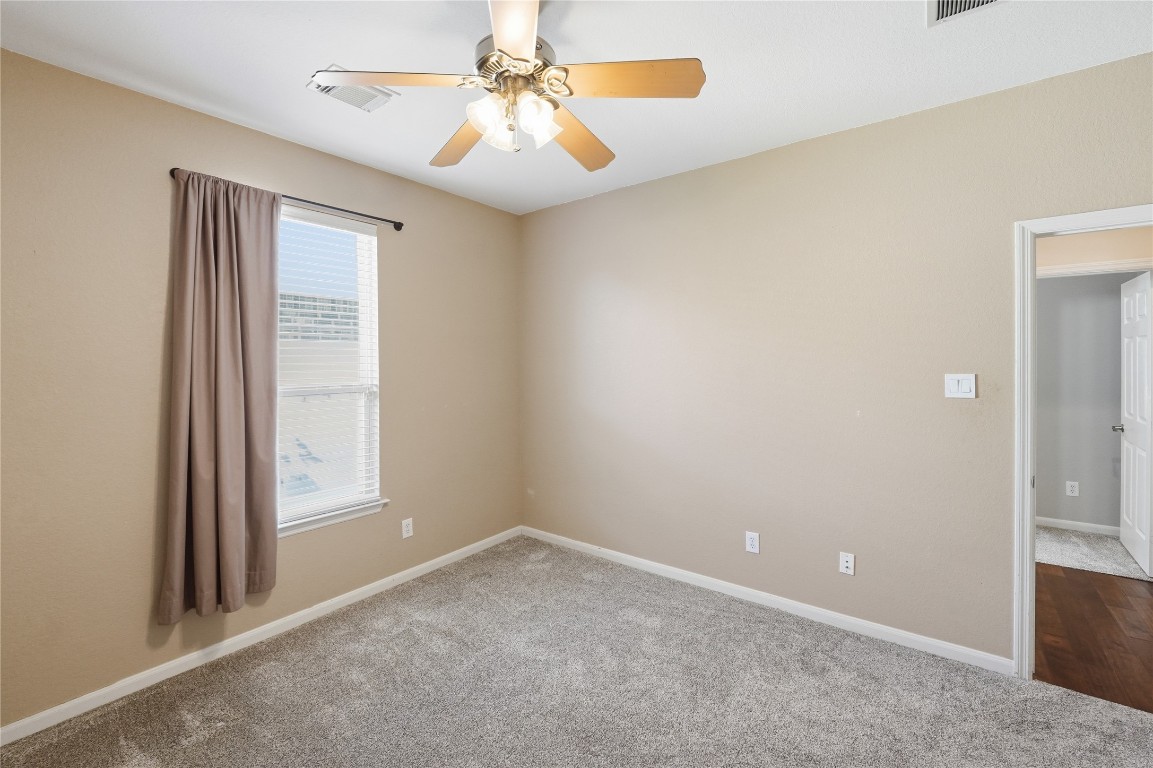 5803 Deleon Trail Drive Spring, TX 77379 - Photo 26 of 33 an empty room with windows and fan