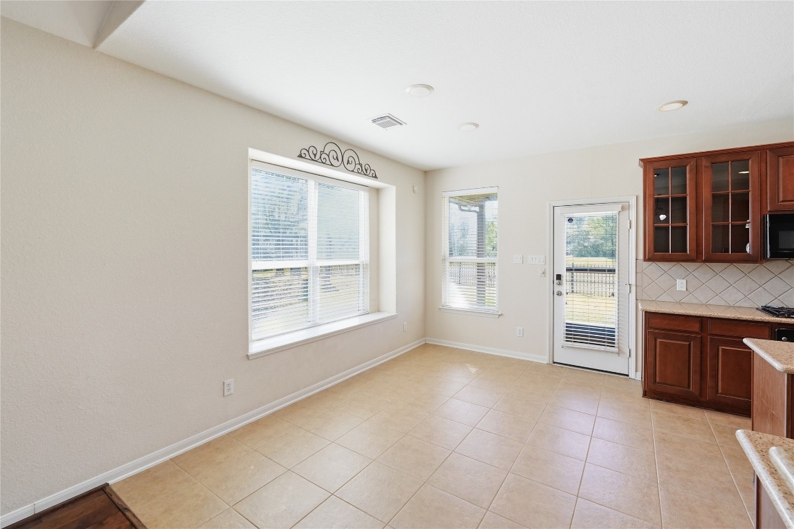 5803 Deleon Trail Drive Spring, TX 77379 - Photo 3 of 33 a view of an empty room with a kitchen