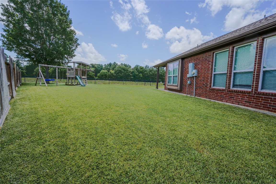 5803 Deleon Trail Drive Spring, TX 77379 - Photo 32 of 33 a view of a house with a backyard porch and sitting area