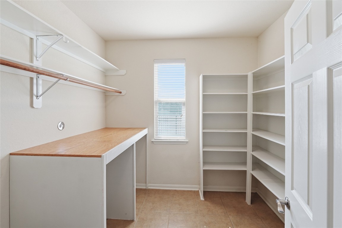 5803 Deleon Trail Drive Spring, TX 77379 - Photo 8 of 33 a utility room with cabinets washer and dryer