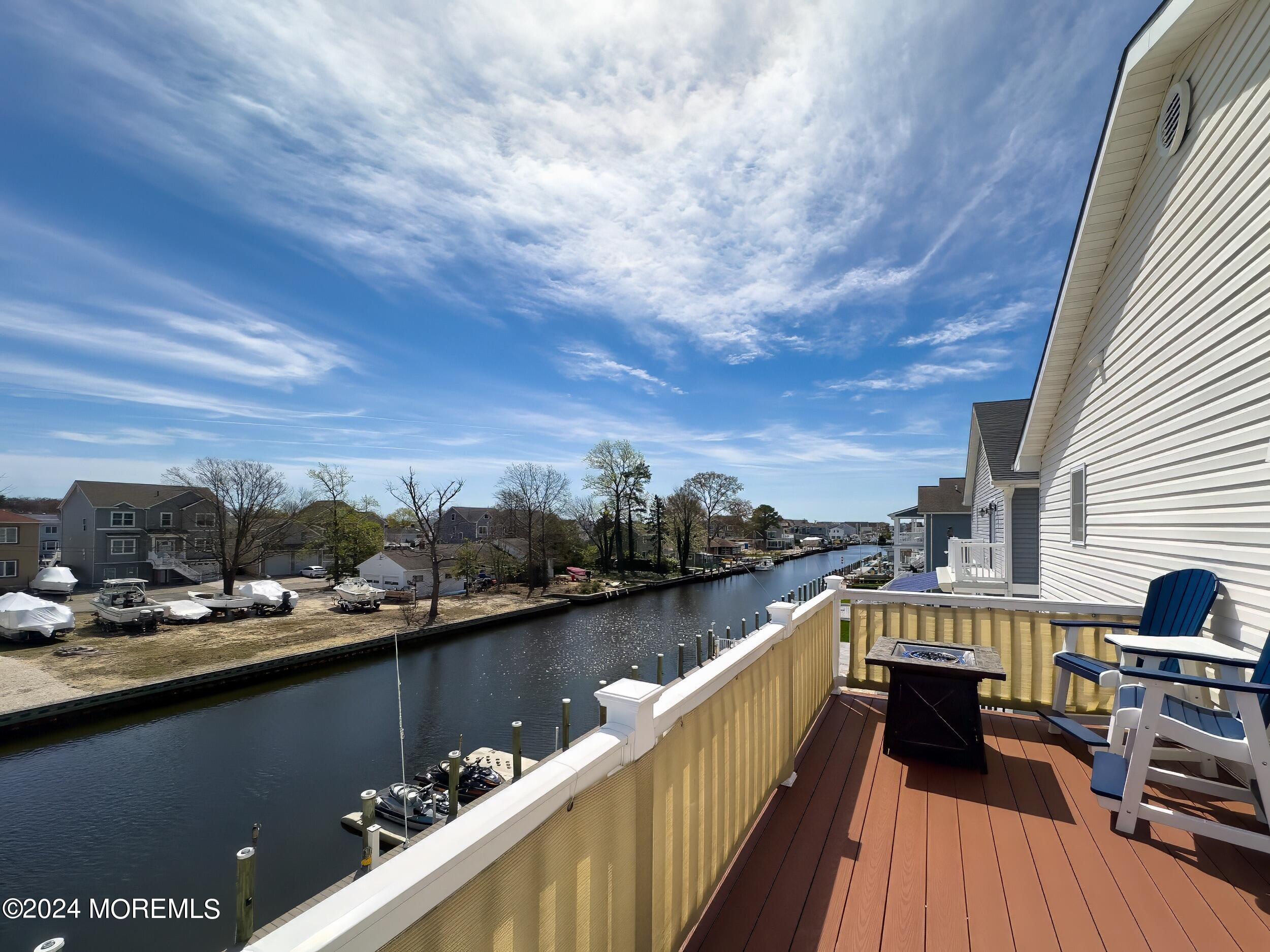 646 Drum Point Road, Unit B Brick, NJ 08723 - Photo 23 of 46 a view of a lake with a terrace