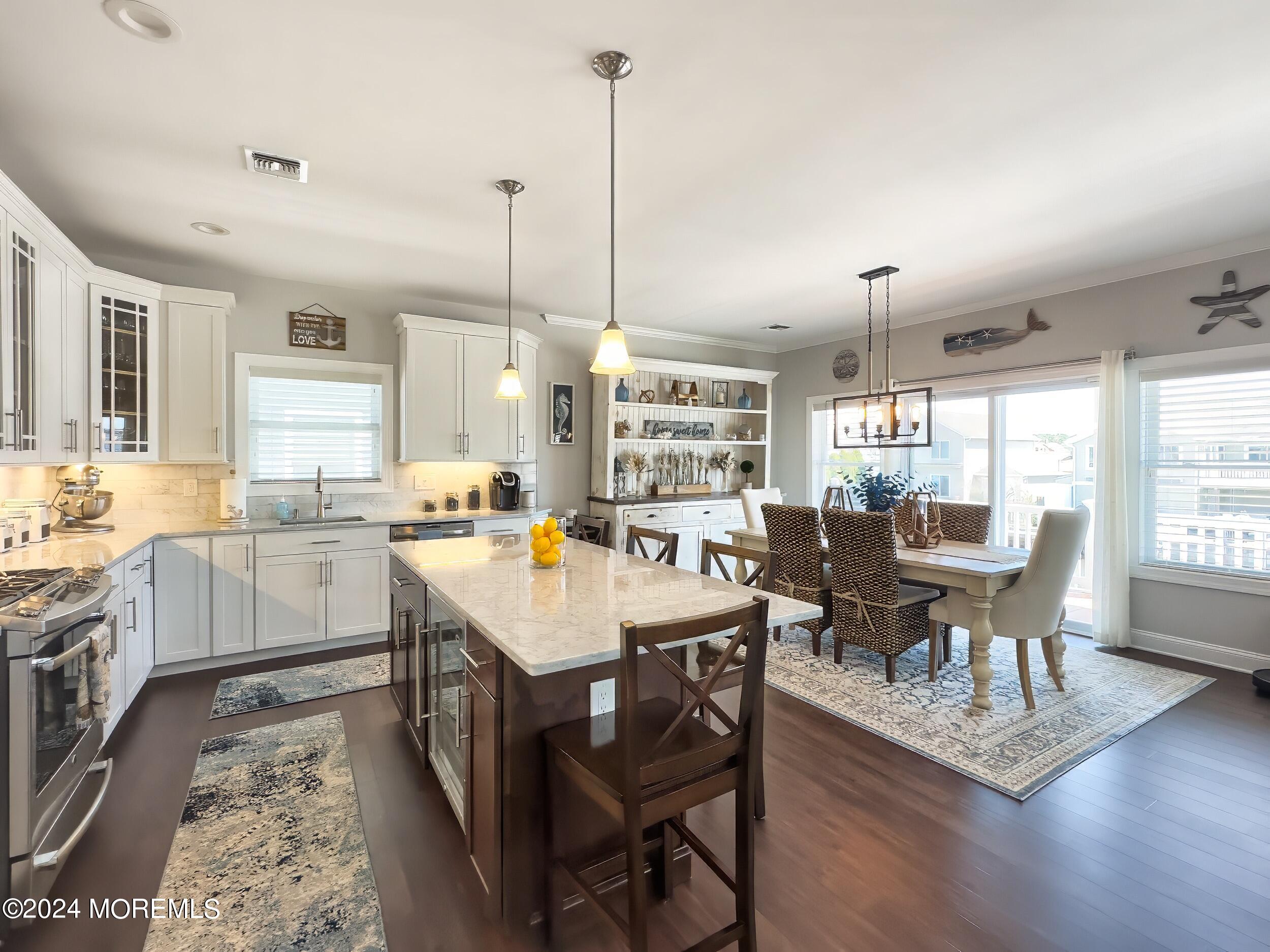 646 Drum Point Road, Unit B Brick, NJ 08723 - Photo 8 of 46 a large kitchen with a table and chairs