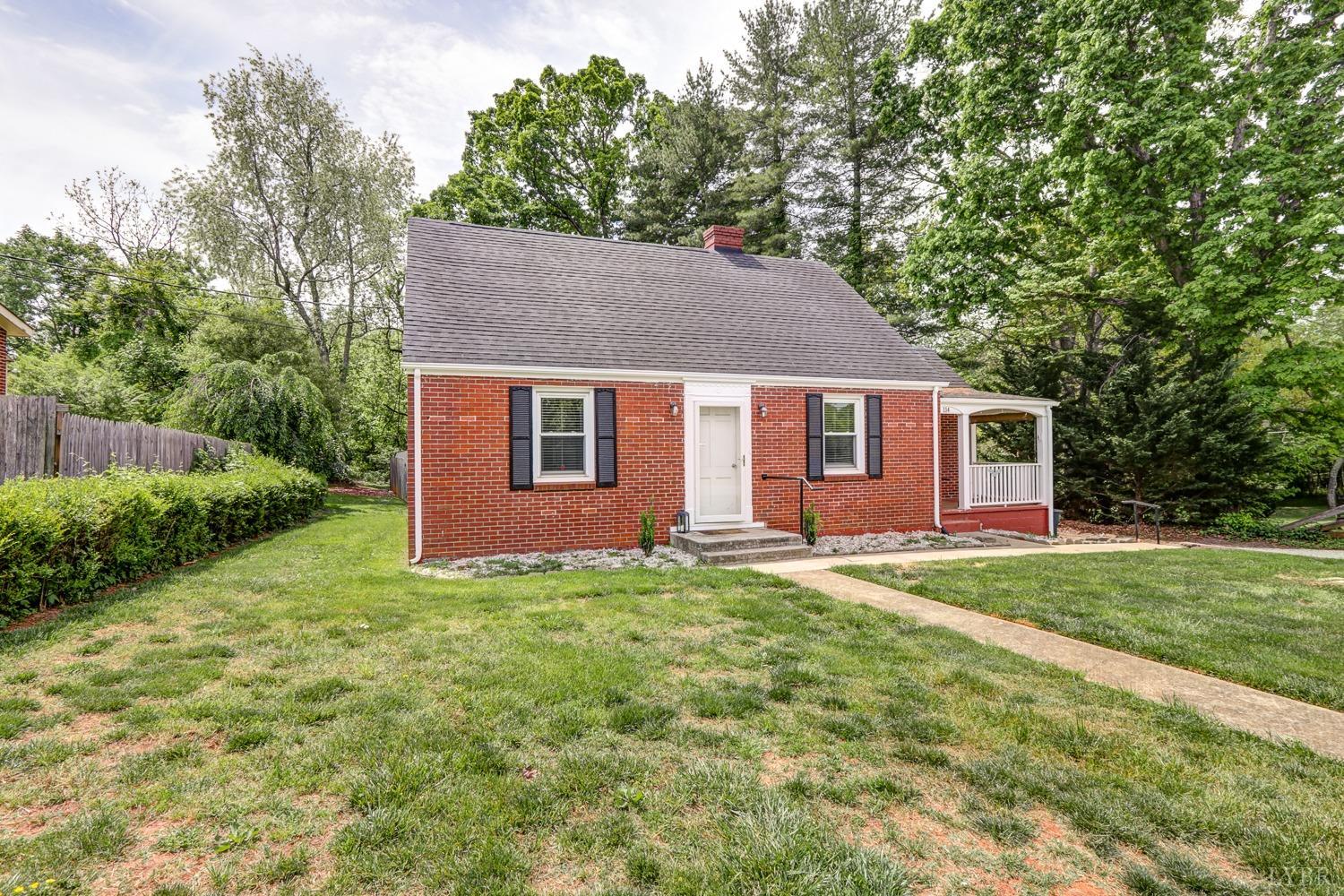 114 Coffee Road Lynchburg, VA 24503 - Photo 3 of 25 a backyard of a house with table and chairs