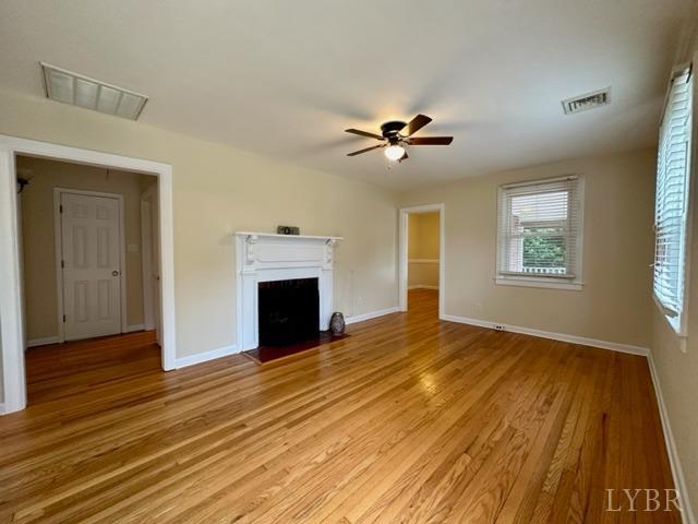 114 Coffee Road Lynchburg, VA 24503 - Photo 4 of 25 a view of an empty room with a fireplace and a window