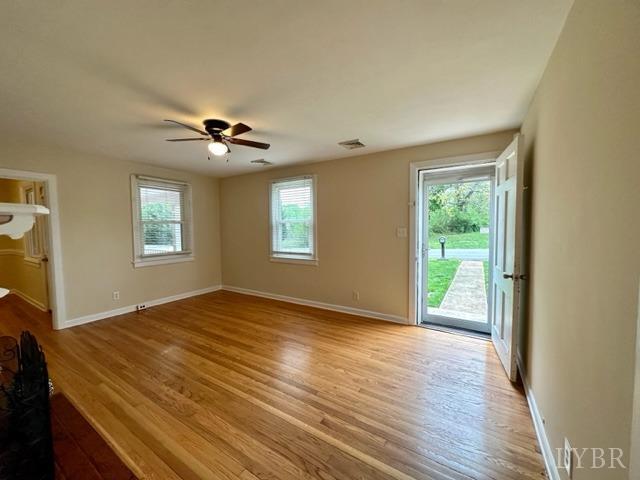 114 Coffee Road Lynchburg, VA 24503 - Photo 5 of 25 a view of a livingroom with a ceiling fan and window