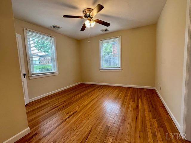 114 Coffee Road Lynchburg, VA 24503 - Photo 8 of 25 a view of empty room with wooden floor and fan