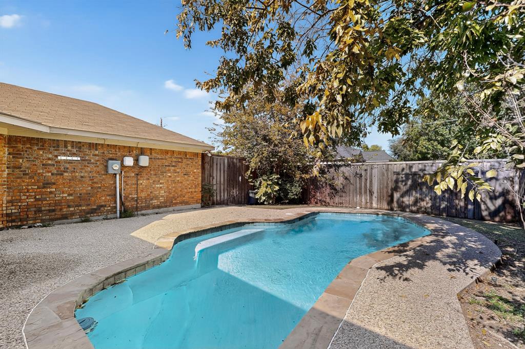 664 Phillips Drive Coppell, TX 75019 - Photo 22 of 23 pool and yard, withseating area.