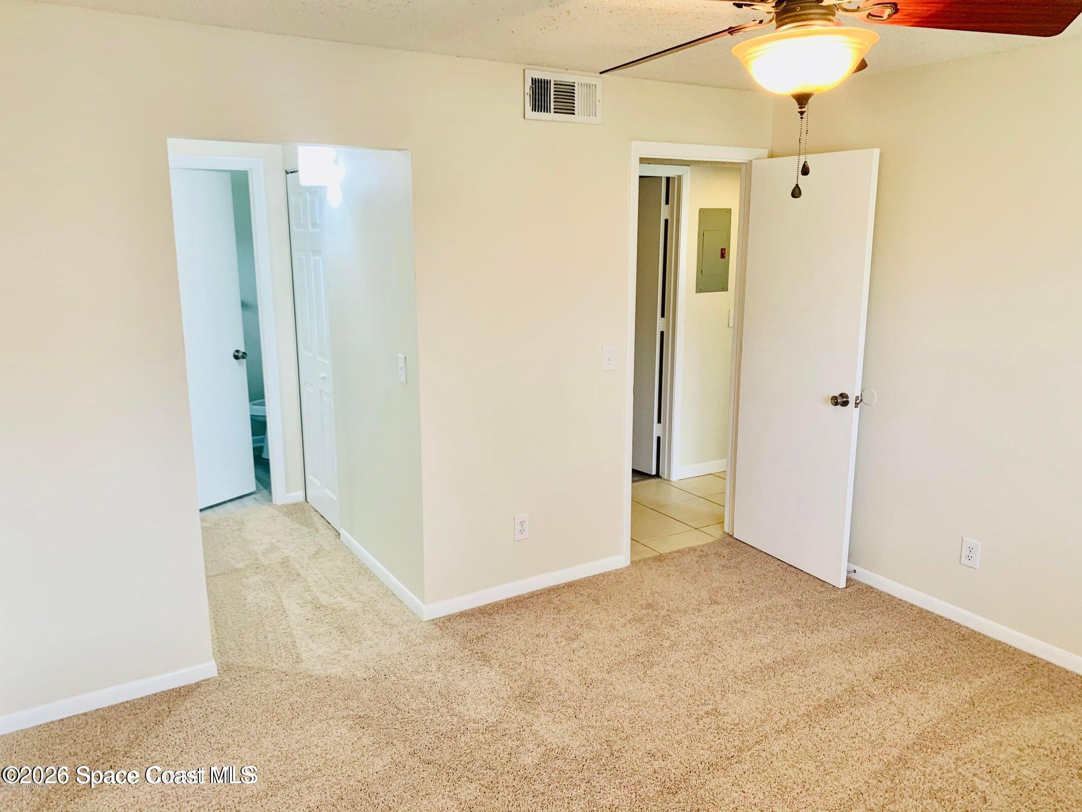1648 Sunny Brook Lane, Unit M202 Palm Bay, FL 32905 - Photo 11 of 15 a view of a bathroom with a shower